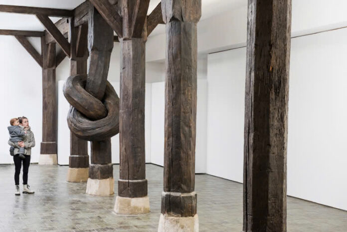 Time-Defying Artistry: Alex Chinneck Knots 450-Year-Old Wood Column